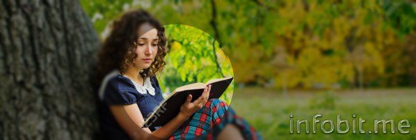 14920973-The-girl-with-book-sitting-under-the-tree-Stock-Photo.jpg